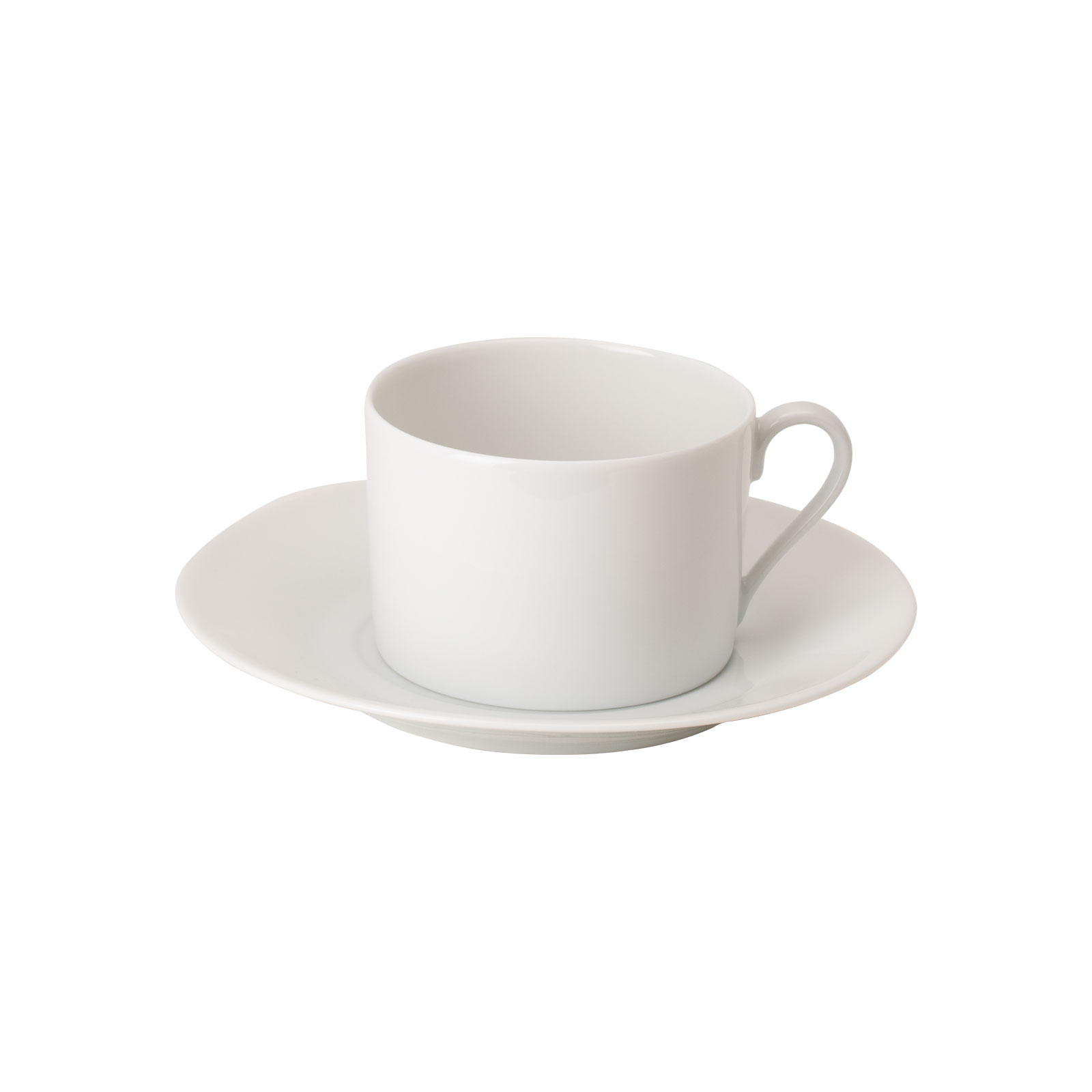 Die Limoges weiß Teetasse mit Untertasse von WEITZ ist eine zylindrische weiße Porzellantasse auf einer leicht konischen Untertasse.