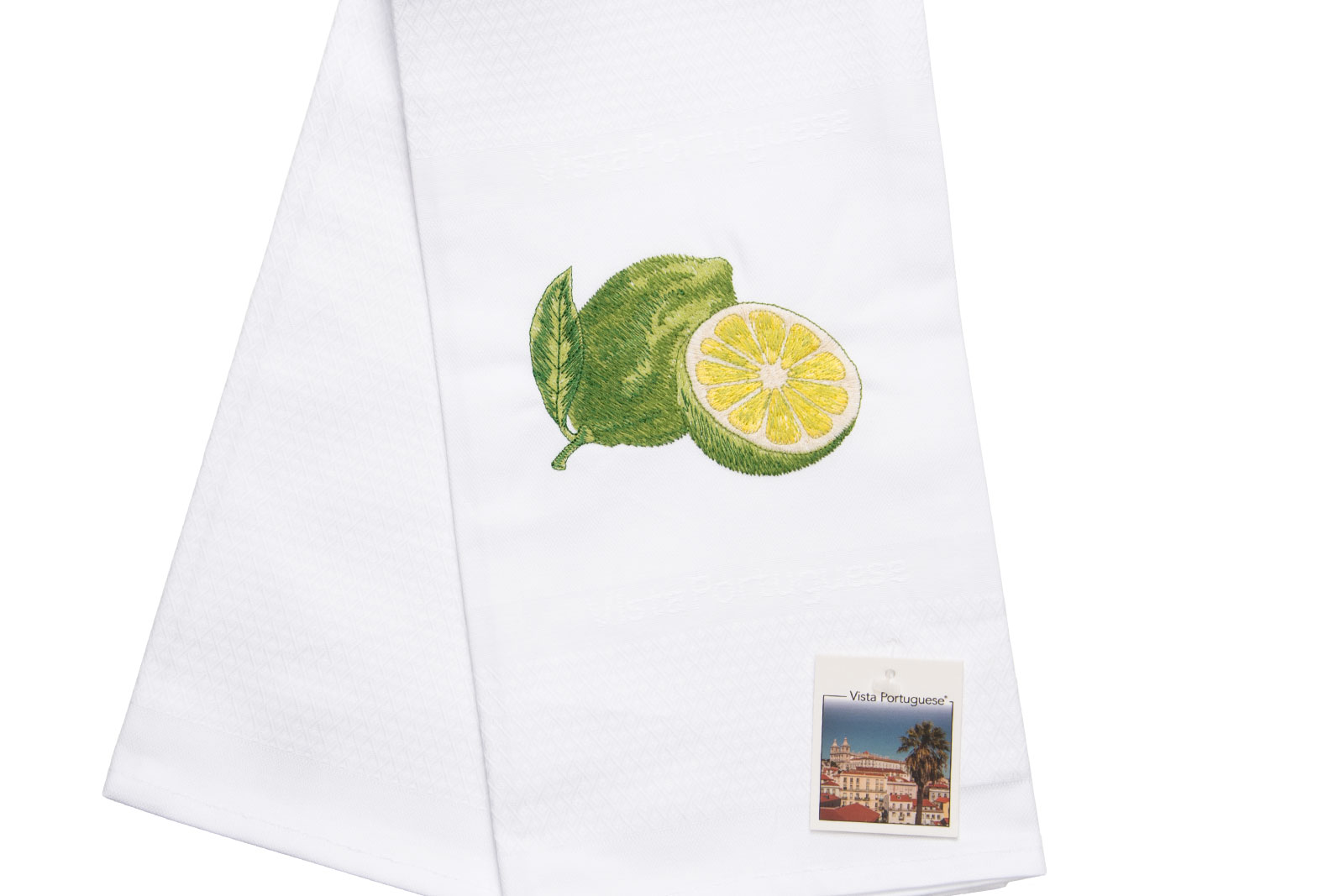 Ausschnitt des Geschirrtuch Lime / Limette 50x70cm von Vista Portuguese. Es ist ein weißes Geschirrhandtuch aus Jacquardstoff mit aufgesticktem Limettenmotiv.