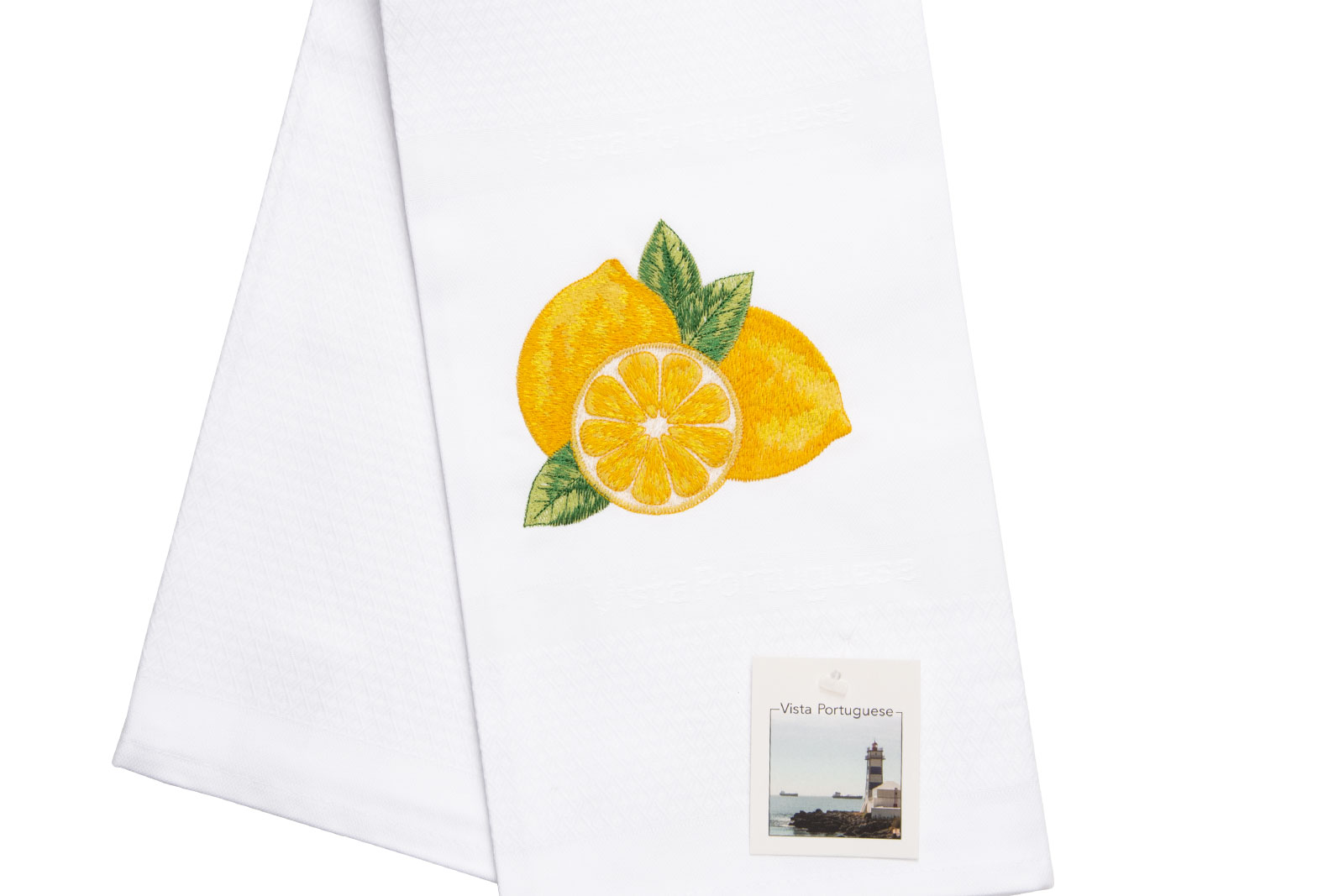 Ausschnit aus dem Geschirrtuch Lemon / Zitrone 50x70cm von Vista Portuguese. Es ist ein weißes Geschirrhandtuch aus Jacquardstoff mit aufgesticktem Zitronenmotiv.